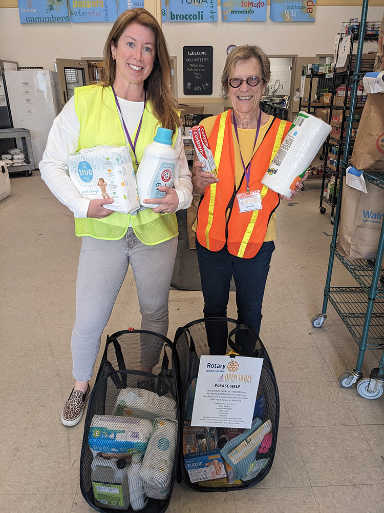Open Table volunteers with donations of personal care items from Acton-Boxborough Rotary