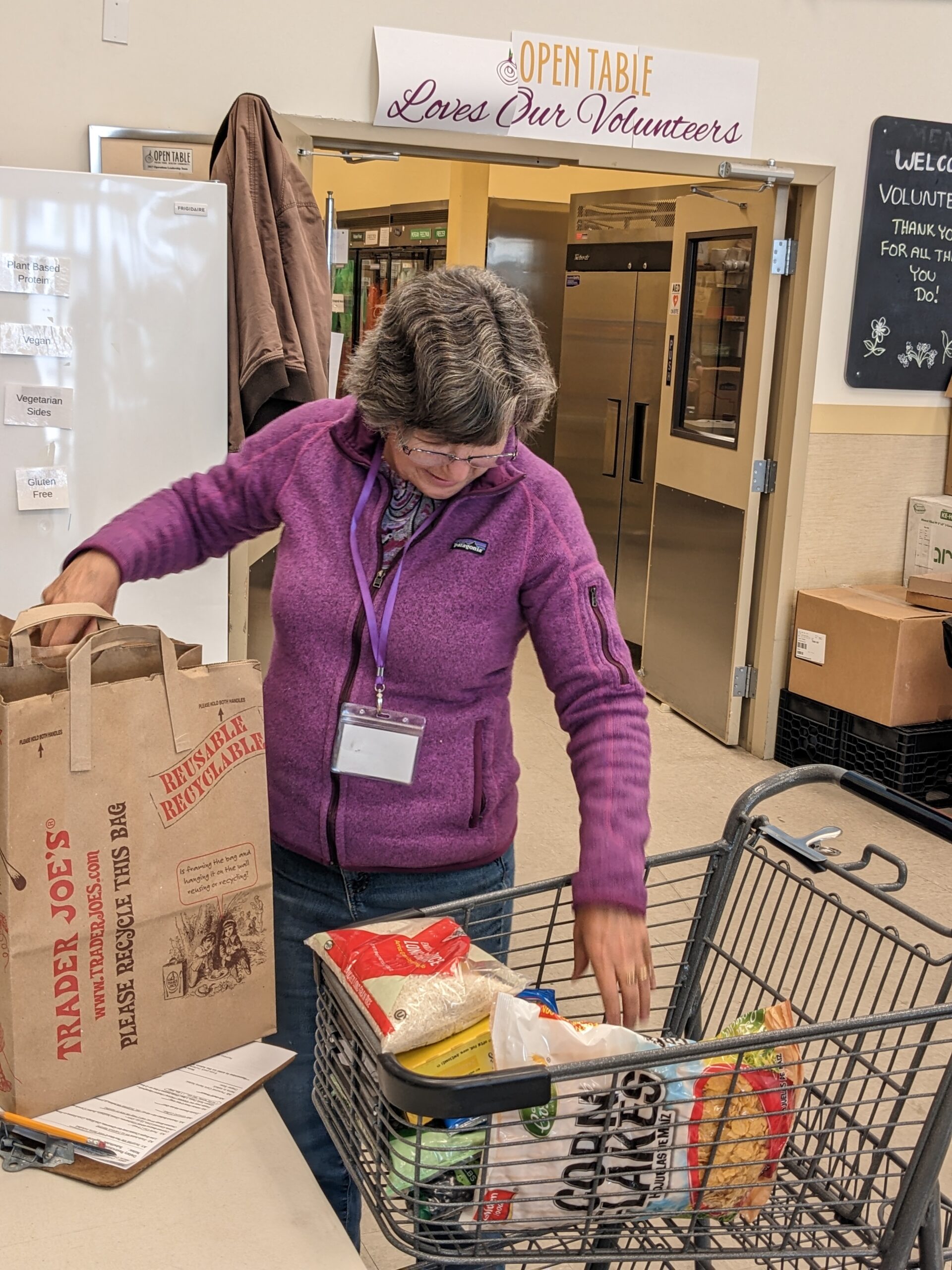 Volunteer packing groceries for Open Table