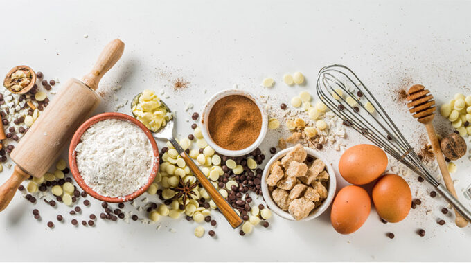 Baking Ingredients And Tools On A White Countertop