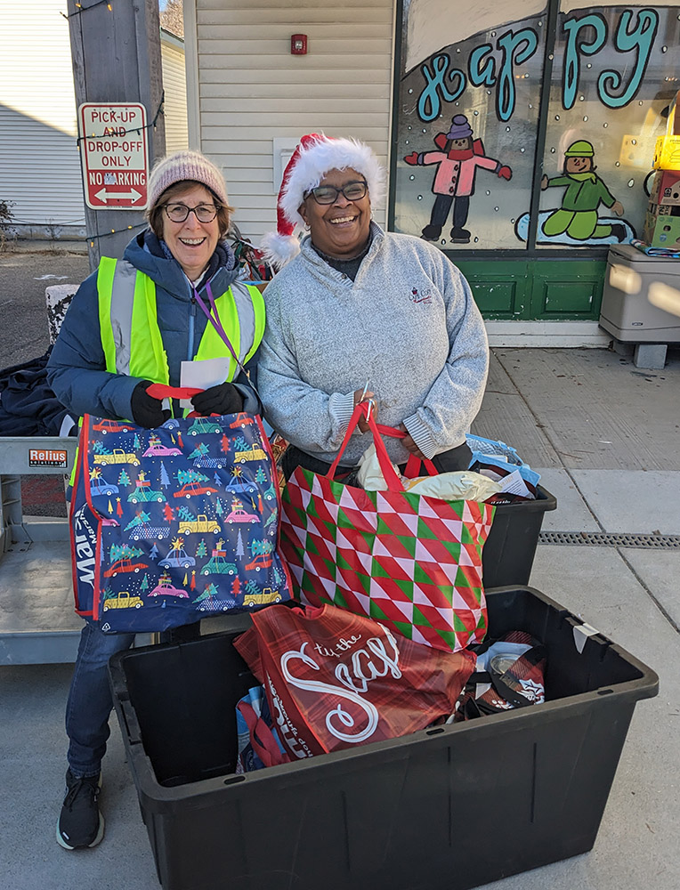 Barbara Fisher and Gina Cummings collecting Family to Family bags in 2023