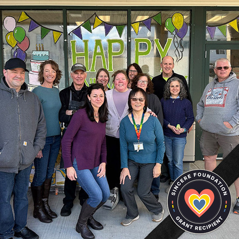Staff out front with Sincere Foundation Grant Recipient logo badge