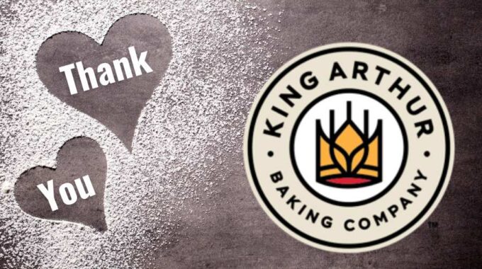 Flour outlined hearts with Thank You in white and then King Arthur Baking Company circle logo on the right