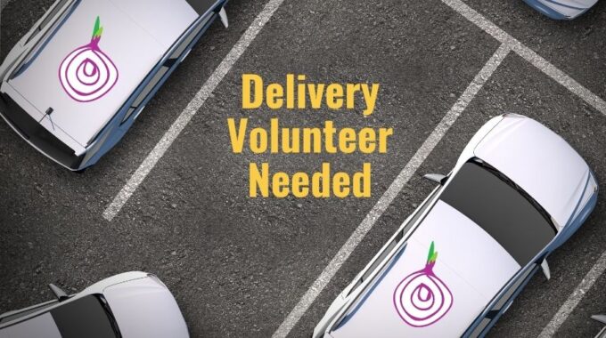 Three parking spaces, two with white cars parked with Open Table onion on them and the words "Delivery Volunteer Needed" in yellow in the empty parking space between them