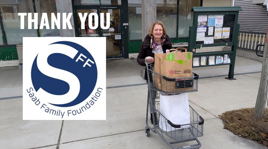 Volunteer pushing a cart of groceries outside our building with "Thank You" in white and the Saab Family Foundation Logo